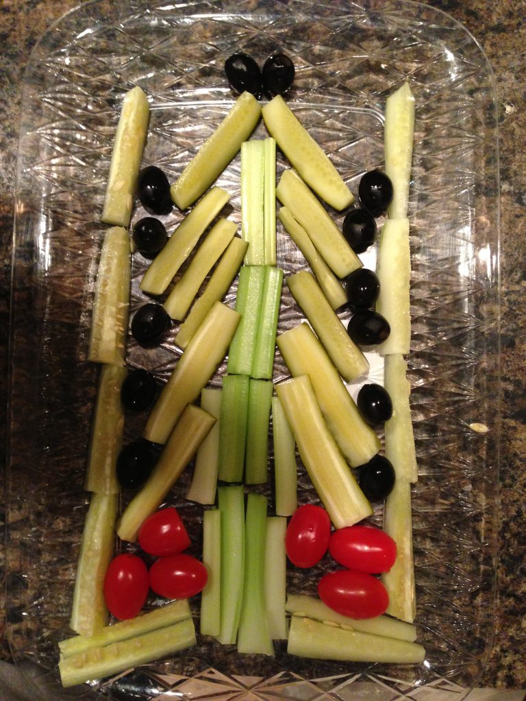 An appetizer tray in the shape of a Christmas tree